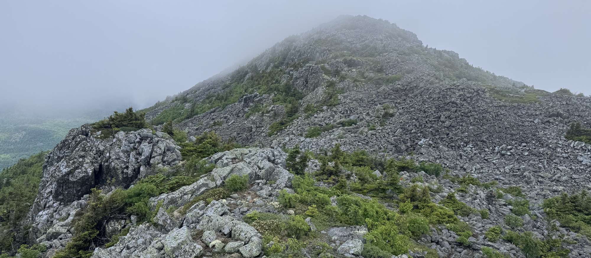 Rocky ridge disappearing into fog on the Travelers Loop